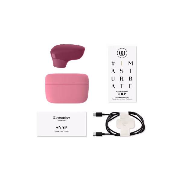 Womanizer Snap : stimulateur clitoridien et boîte de chargement